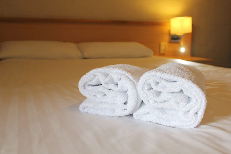 Bedside lamp pillows and hotel room bed with fres 2026 01 06 10 12 38 utc